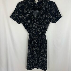 Elegant Black Dress with White Faces Pattern